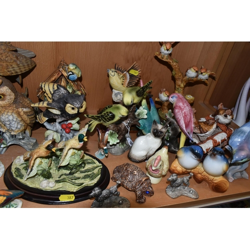 387 - A COLLECTION OF BIRD AND ANIMAL ORNAMENTS, comprising a chalkware Blue Tits 'Bird House' figure, a t... 