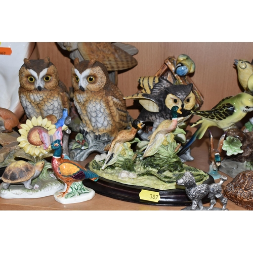 387 - A COLLECTION OF BIRD AND ANIMAL ORNAMENTS, comprising a chalkware Blue Tits 'Bird House' figure, a t... 