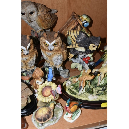 387 - A COLLECTION OF BIRD AND ANIMAL ORNAMENTS, comprising a chalkware Blue Tits 'Bird House' figure, a t... 