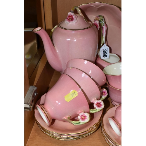 396 - THIRTY EIGHT PIECES OF ROYAL WINTON PINK 'PETUNIA' TEA AND DINNER WARES, comprising a coffee pot (co... 