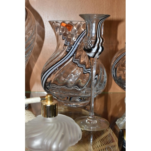 400 - A COLLECTION OF STUDIO GLASS, comprising a Dartington Crystal mantel clock, an amber glass Murano bu... 