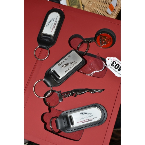 403 - A PRESENTATION BOXED SET OF JAGUAR KEY RINGS,  four bill folds to include a silver dollar 1974, Bell... 