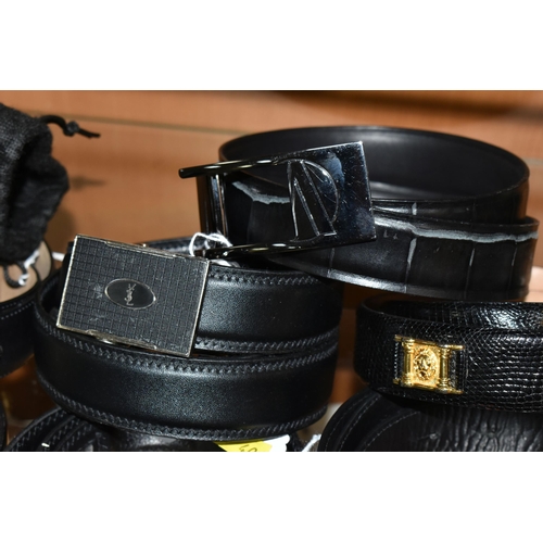 404 - A GROUP OF NINE GENTLEMENS DESIGNER LEATHER BELTS, black belts comprising maker's names Hugo Boss, D... 