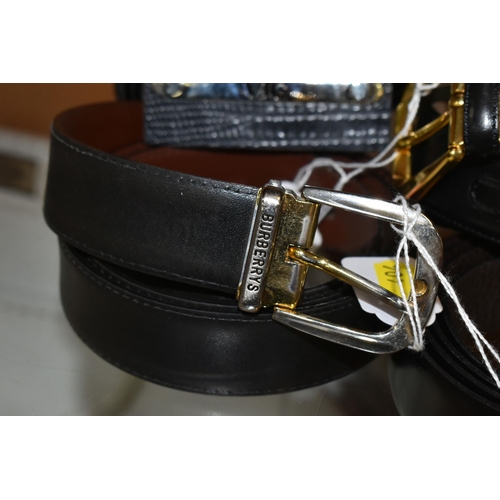 404 - A GROUP OF NINE GENTLEMENS DESIGNER LEATHER BELTS, black belts comprising maker's names Hugo Boss, D... 