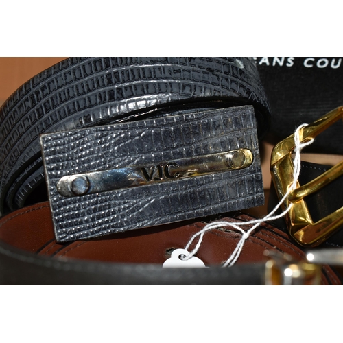 404 - A GROUP OF NINE GENTLEMENS DESIGNER LEATHER BELTS, black belts comprising maker's names Hugo Boss, D... 