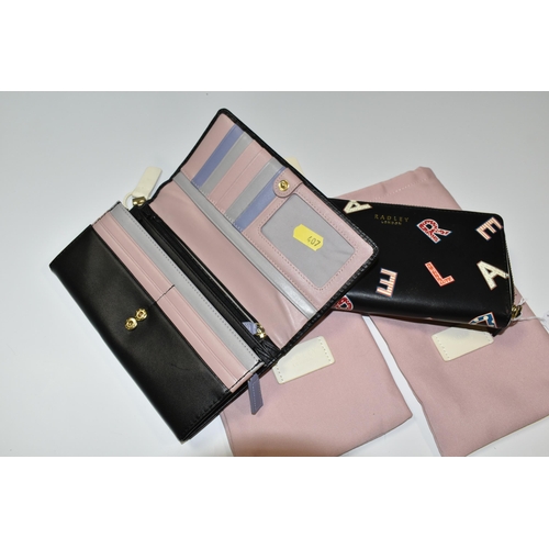 407 - TWO RADLEY PURSES WITH ORIGINAL DUST BAGS, each purse is black leather with iconic Radley design (2)... 