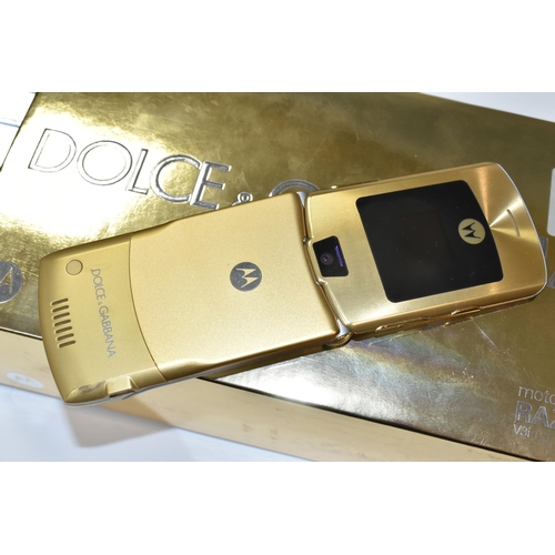 408 - A DOLCE & GABBANA BOXED MOTOROLLA RAZR V3i MOBILE PHONE, in original gold and silver packaging, with... 