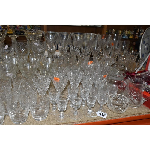 424 - A GROUP OF CUT CRYSTAL AND GLASSWARE to include a large quantity of mixed wine, port, whisky, brandy... 