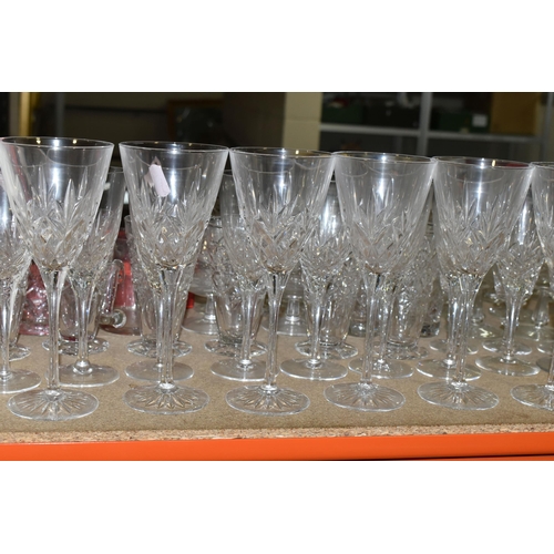 424 - A GROUP OF CUT CRYSTAL AND GLASSWARE to include a large quantity of mixed wine, port, whisky, brandy... 