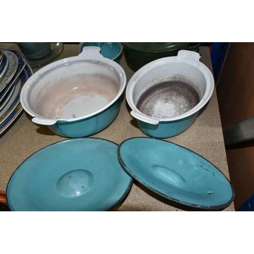 426 - FOUR LE CREUSET CASSEROLE DISHES to include a lidded 18cm turquoise dish, a circular 24cm ovoid turq... 