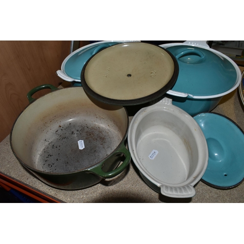 426 - FOUR LE CREUSET CASSEROLE DISHES to include a lidded 18cm turquoise dish, a circular 24cm ovoid turq... 