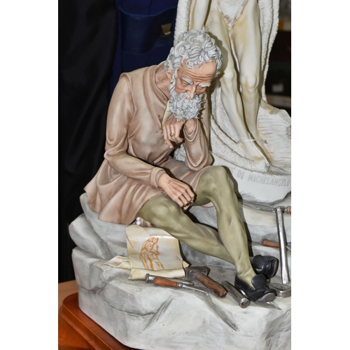 430 - A LARGE CAPODIMONTE STATUE OF MICHELANGELO BY GERMANO CORTESE Michelangelo seated by a sculpture tit... 