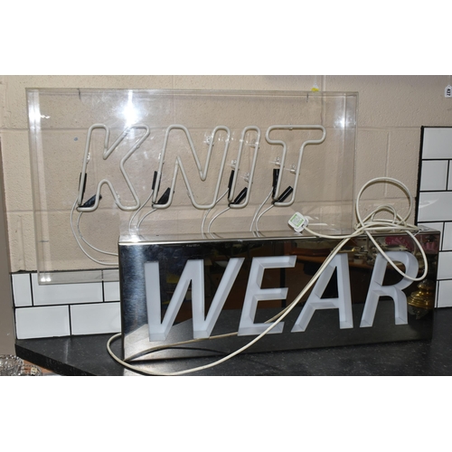 435 - A KNIT WEAR NEON SIGN, a Knit Wear Neon Sign set in Perspex and metal frame, height 72cm x length 11... 