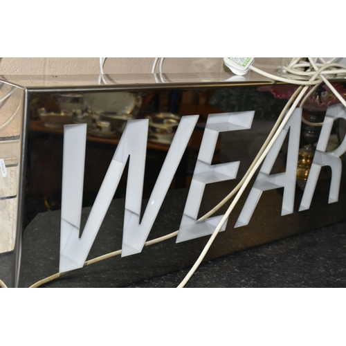 435 - A KNIT WEAR NEON SIGN, a Knit Wear Neon Sign set in Perspex and metal frame, height 72cm x length 11... 