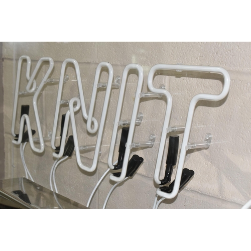 435 - A KNIT WEAR NEON SIGN, a Knit Wear Neon Sign set in Perspex and metal frame, height 72cm x length 11... 