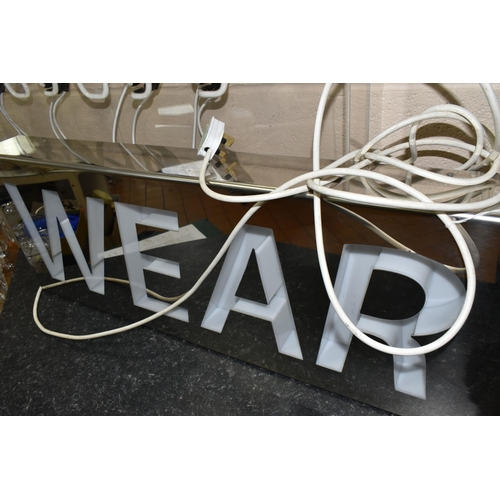 435 - A KNIT WEAR NEON SIGN, a Knit Wear Neon Sign set in Perspex and metal frame, height 72cm x length 11... 