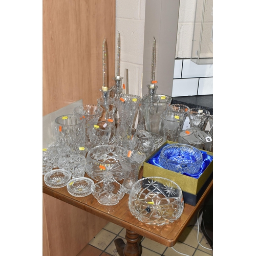 438 - A LARGE GROUP OF CRYSTAL CUT GLASSES to include a boxed Tutbury Crystal fruit bowl, a pair of etched... 