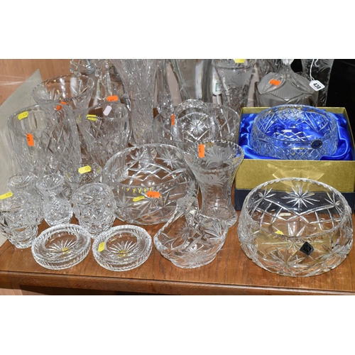 438 - A LARGE GROUP OF CRYSTAL CUT GLASSES to include a boxed Tutbury Crystal fruit bowl, a pair of etched... 