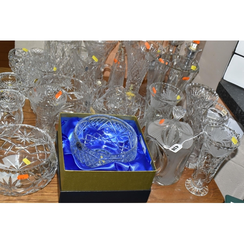 438 - A LARGE GROUP OF CRYSTAL CUT GLASSES to include a boxed Tutbury Crystal fruit bowl, a pair of etched... 