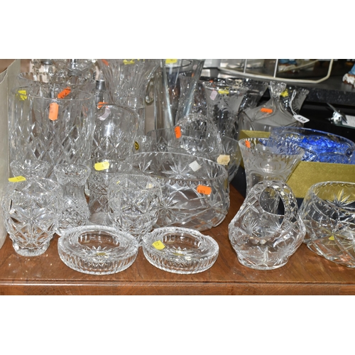 438 - A LARGE GROUP OF CRYSTAL CUT GLASSES to include a boxed Tutbury Crystal fruit bowl, a pair of etched... 