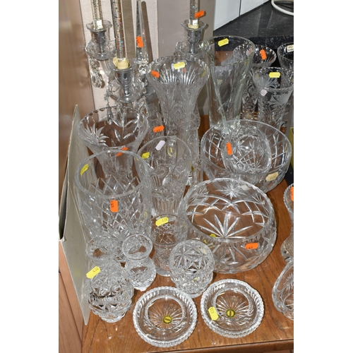 438 - A LARGE GROUP OF CRYSTAL CUT GLASSES to include a boxed Tutbury Crystal fruit bowl, a pair of etched... 