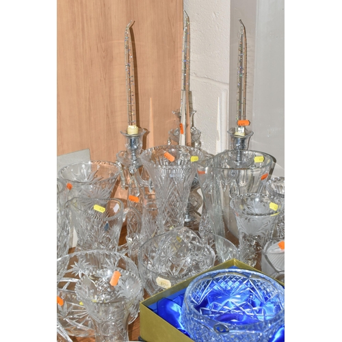 438 - A LARGE GROUP OF CRYSTAL CUT GLASSES to include a boxed Tutbury Crystal fruit bowl, a pair of etched... 