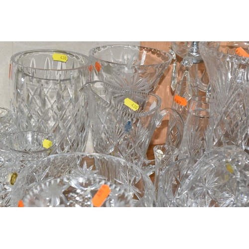 438 - A LARGE GROUP OF CRYSTAL CUT GLASSES to include a boxed Tutbury Crystal fruit bowl, a pair of etched... 