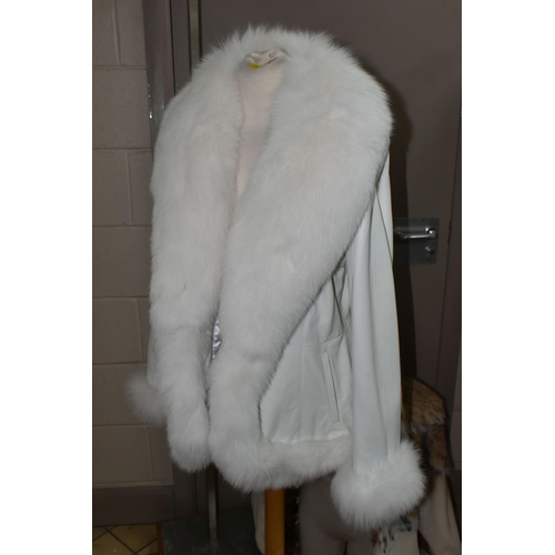 443 - THREE LADIES' LEATHER AND FUR JACKETS, comprising a pale cream fur jacket with  lynx fur collar and ... 