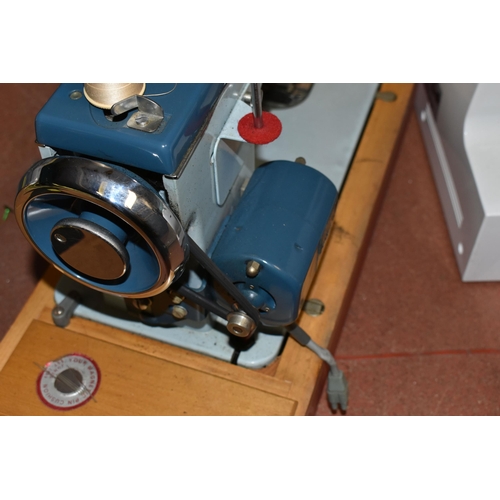 449 - THREE ELECTRIC SEWING MACHINES, included a vintage Jones heavy duty in a case, Singer Talent 3321 in... 