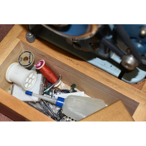 449 - THREE ELECTRIC SEWING MACHINES, included a vintage Jones heavy duty in a case, Singer Talent 3321 in... 