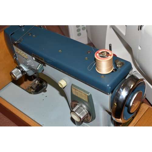 449 - THREE ELECTRIC SEWING MACHINES, included a vintage Jones heavy duty in a case, Singer Talent 3321 in... 