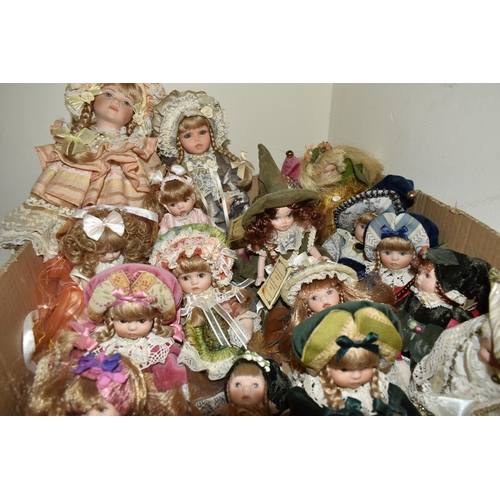 469 - TWO BOXES OF VENETIAN PORCELAIN DOLLS, to include named Marael  dolls Monpau and Nell (Monpau has a ... 