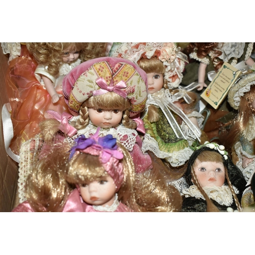 469 - TWO BOXES OF VENETIAN PORCELAIN DOLLS, to include named Marael  dolls Monpau and Nell (Monpau has a ... 