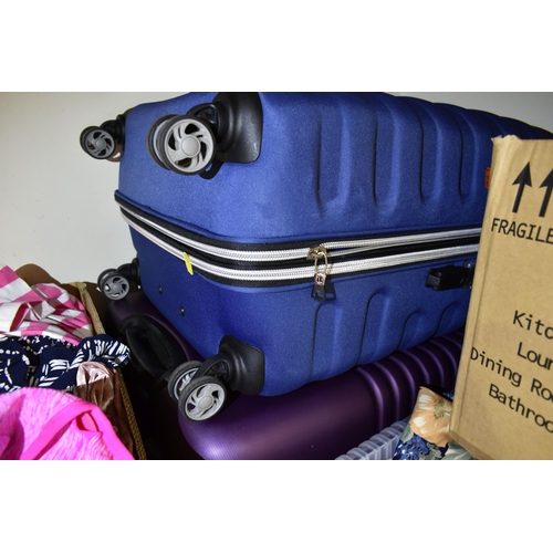 472 - SIX BOXES OF LADIES CLOTHING AND THREE MODERN SUITCASES, to include a small 'Constellation' suitcase... 