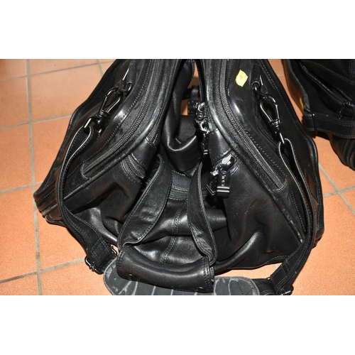 492 - TWO BLACK LEATHER TUMI HOLDALLS with leather name tags, height 28cm x length 40cm x width 20cm (2) (... 