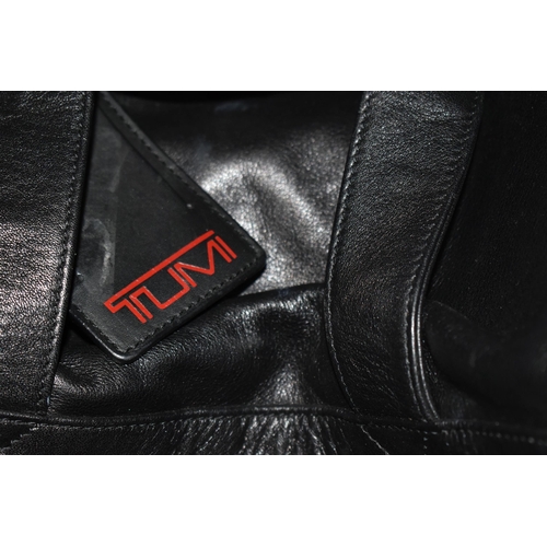 492 - TWO BLACK LEATHER TUMI HOLDALLS with leather name tags, height 28cm x length 40cm x width 20cm (2) (... 