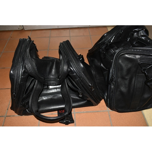 492 - TWO BLACK LEATHER TUMI HOLDALLS with leather name tags, height 28cm x length 40cm x width 20cm (2) (... 