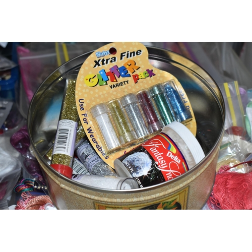 512 - FIVE BOXES OF ARTS AND CRAFTS SUPPLIES to include a large quantity of threads, string, and glitter, ... 