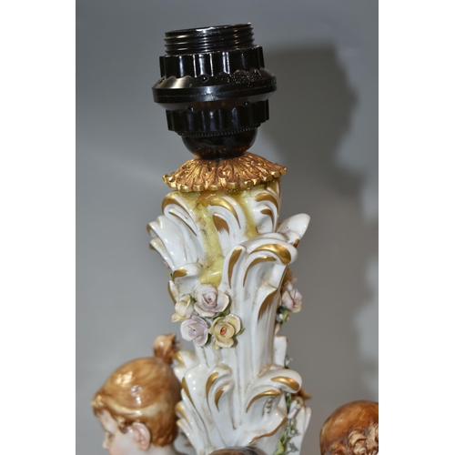 376 - A CAPODIMONTE PORCELAIN FIGURAL TABLE LAMP, signature 'Galletto', depicting four Putti dancing aroun... 