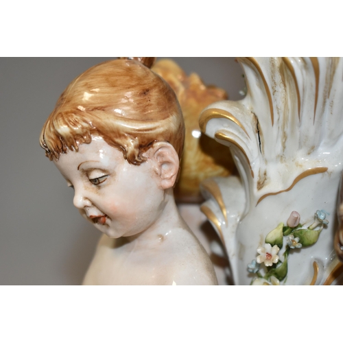 376 - A CAPODIMONTE PORCELAIN FIGURAL TABLE LAMP, signature 'Galletto', depicting four Putti dancing aroun... 