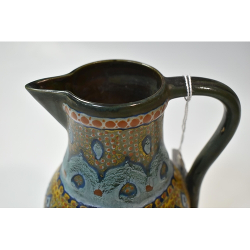 390 - A LIBERTY & CO. ARTS & CRAFTS JUG, decorated in a green, turquoise and yellow Peacock feather design... 