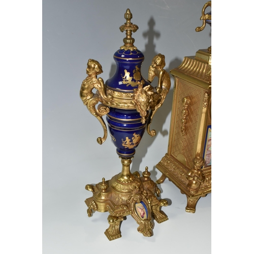 317 - AN ITALIAN CLOCK GARNITURE, gilt metal and ceramic, the garniture faux covered vases, all pieces dec... 