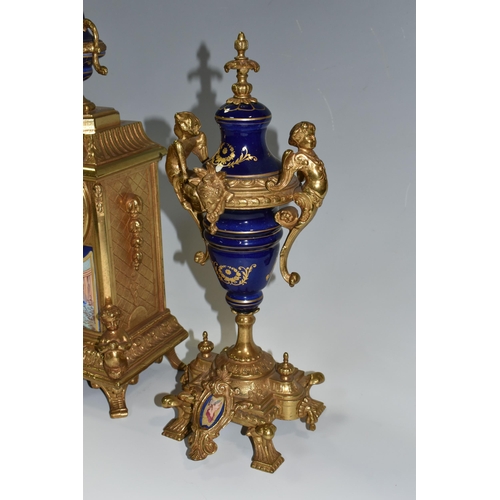 317 - AN ITALIAN CLOCK GARNITURE, gilt metal and ceramic, the garniture faux covered vases, all pieces dec... 