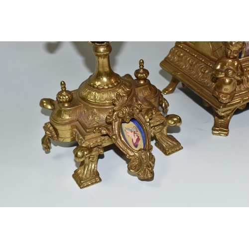 317 - AN ITALIAN CLOCK GARNITURE, gilt metal and ceramic, the garniture faux covered vases, all pieces dec... 