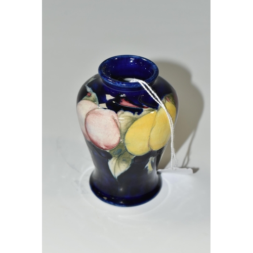 324 - A MOORCROFT POTTERY SMALL 'WISTERIA' PATTERN VASE, of baluster form, tube lined with red, purple and... 