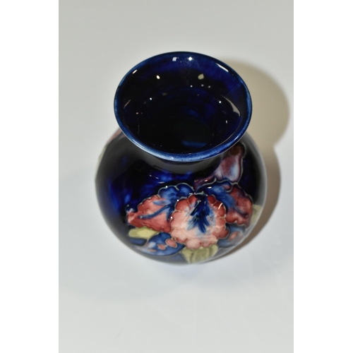 349 - A MOORCROFT POTTERY SMALL 'ORCHID' PATTERN VASE, of baluster form, tube lined with red, purple, blue... 