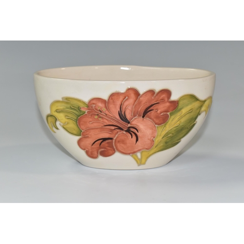 350 - A MOORCROFT POTTERY 'CORAL HIBISCUS' PATTERN BOWL, of oval form, tube lined with coral pink hibiscus... 