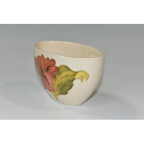 350 - A MOORCROFT POTTERY 'CORAL HIBISCUS' PATTERN BOWL, of oval form, tube lined with coral pink hibiscus... 