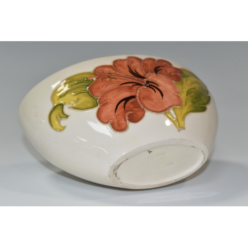 350 - A MOORCROFT POTTERY 'CORAL HIBISCUS' PATTERN BOWL, of oval form, tube lined with coral pink hibiscus... 