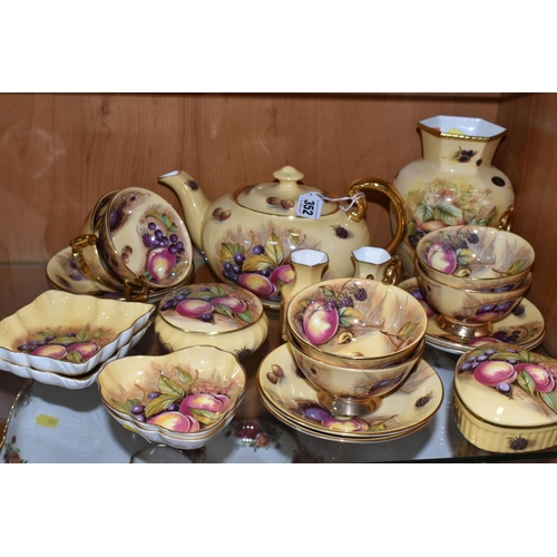 352 - A COLLECTION OF AYNSLEY 'ORCHARD GOLD' PATTERN TEA AND GIFTWARE, comprising an oval  teapot  with pr... 